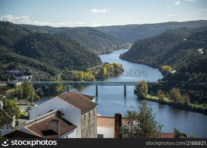 The landscape with the Bridge and Ponte de Belver at the Rio Tejo at the Town of Belver in Alentejo in  Portugal.  Portugal, Belver, October, 2021