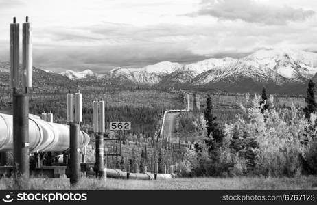 The large diameter pipe that cuts across the mountainous Alaska Landscape