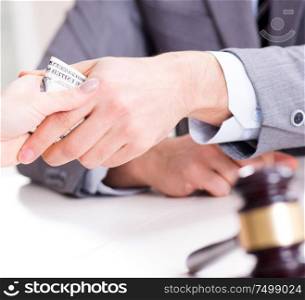 The lawyer being offered bribe for his services. Lawyer being offered bribe for his services