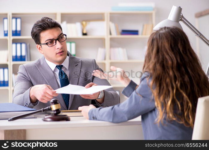 The lawyer discussing legal case with client. Lawyer discussing legal case with client