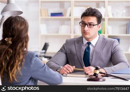 The lawyer discussing legal case with client. Lawyer discussing legal case with client