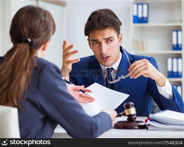 The lawyer talking to his client in office. Lawyer talking to his client in office