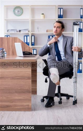 The leg injured male employee in the office . Leg injured male employee in the office 