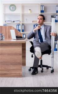 The leg injured male employee in the office . Leg injured male employee in the office 