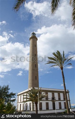 The lighrhouse Maspalomas Faro at the southern cape of the island Gran Canaria in Spain. This is a very popular resort for european tourists.