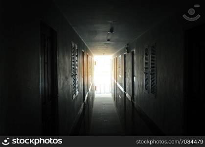 The light from the window of an old hotel corridor.