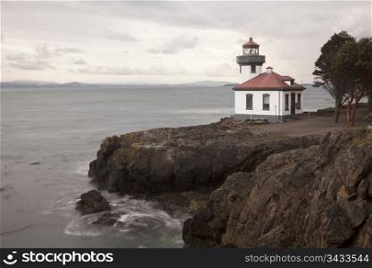 The lighthouse at Lime Kiln Point State Park on San Juan Island. The building looks out over the waters of Puget Sound.