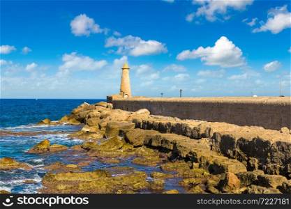 The lighthouse in historical Kyrenia harbour in North Cyprus in a beautiful summer day