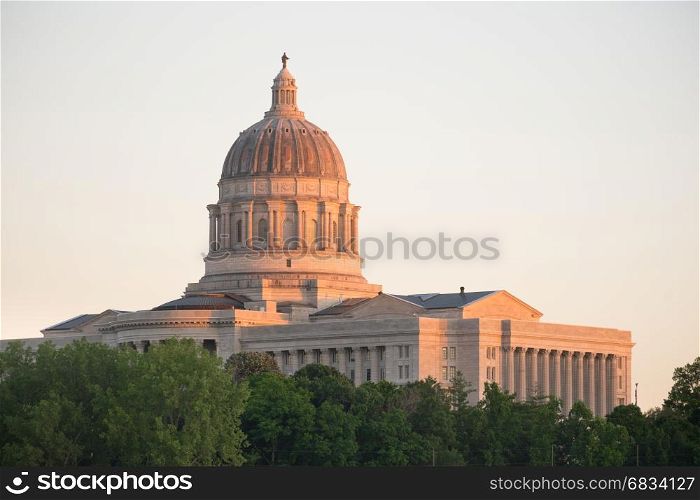 The lights come up as the sun fades on the capital building downtown Jefferson City, Missouri