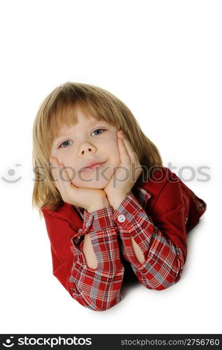 The little boy lays on a floor. It is isolated on a white background