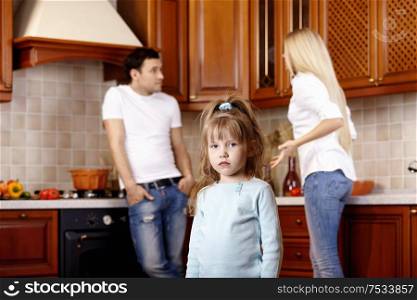 The little girl against quarrel of parents