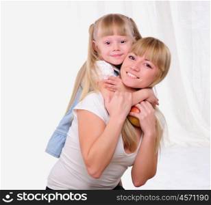 The little girl and her mother together having fun