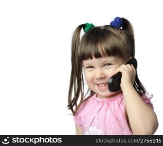 The little girl with a mobile phone. It is isolated on a white background