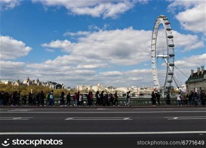 The London Eye is a giant Ferris wheel on the South Bank of the River Thames in London.