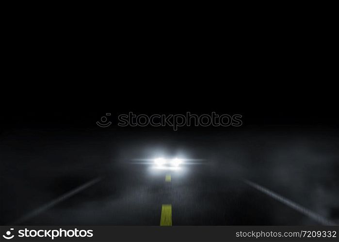 The lonely road fog at night with the car running.