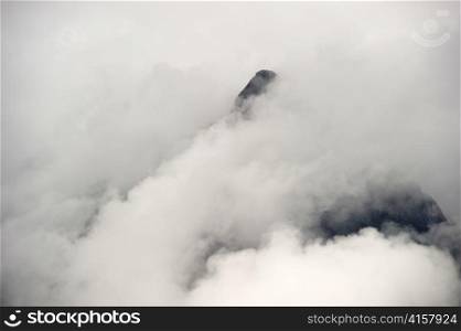 The Lost City of The Incas covered with clouds, Machu Picchu, Cusco Region, Peru
