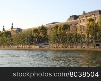 The Louvre across the Seine River in Paris France