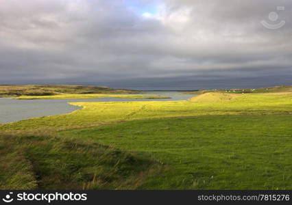 The low striking light hits the plains of the West Icelandic delta near Borganes on a pleasant evening with a gentil breeze