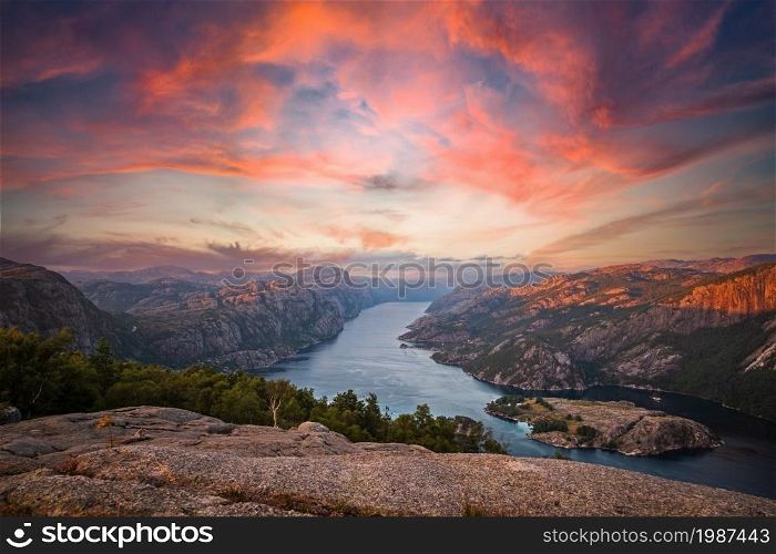 The Lysefjord in Norway with a colorful sunset. View from the Preikestolen
