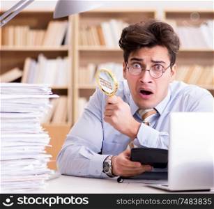 The mad auditor looking for errors in the report. Mad auditor looking for errors in the report
