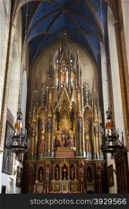 The main altar in the Dominican Church in the city of Krakow in Poland. The Dominican Order built the original church here in 1250. It was destroyed by fire in 1850. The present church dates from 1872 and contain the shrine of St. Jacek, a place of mass pilgrimage.