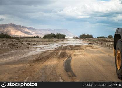 the main road 90 in Israel near Masada is blocked by floods and mud, the road goes from Eilat to jerusalem. floods and mud on the route in israel