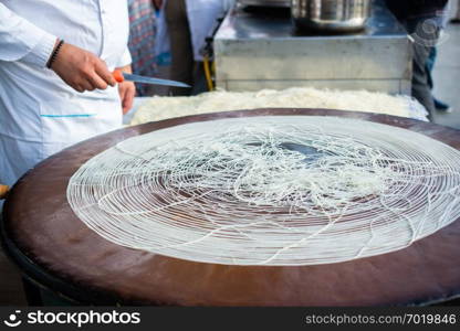 The making of Turkish desert Kadayif pastry in display