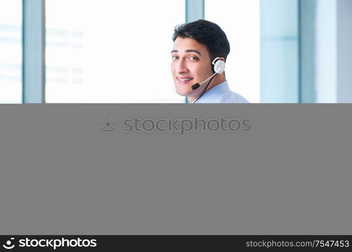 The male call-center operator in business concept. Male call-center operator in business concept