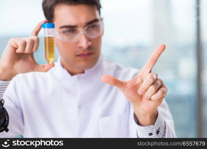 The male chemist working in lab. Male chemist working in lab