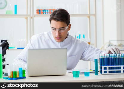 The male chemist working in lab. Male chemist working in lab