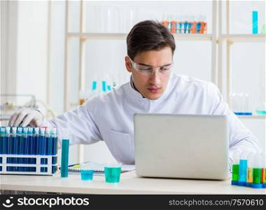 The male chemist working in lab. Male chemist working in lab