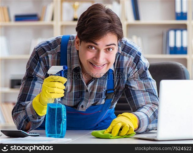 The male cleaner working in the office. Male cleaner working in the office