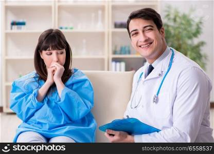 The male doctor checking up female patient in hospital. Male doctor checking up female patient in hospital