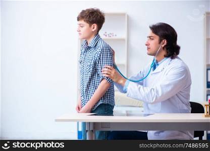The male doctor examining boy by stethoscope. Male doctor examining boy by stethoscope