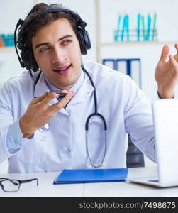 The male doctor listening to patient during telemedicine session. Male doctor listening to patient during telemedicine session