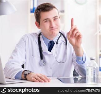 The male doctor looking at lab results in hospital. Male doctor looking at lab results in hospital