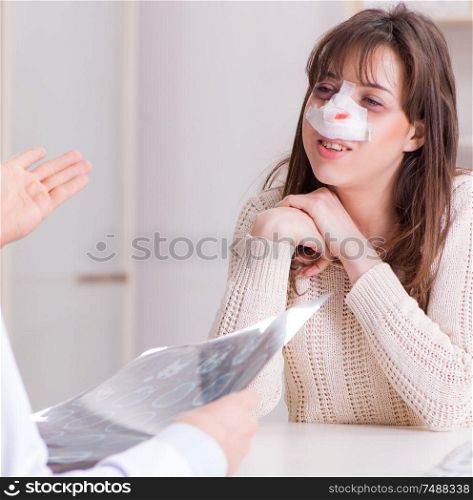 The male doctor talking to patient with nose operation surgery. Male doctor talking to patient with nose operation surgery