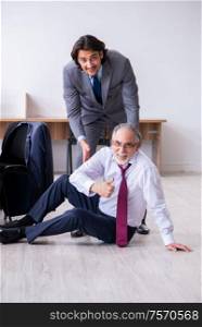 The male employee suffering from heart attack in the office. Male employee suffering from heart attack in the office