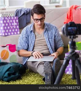 The male fashion blogger recording video for vlog. Male fashion blogger recording video for vlog