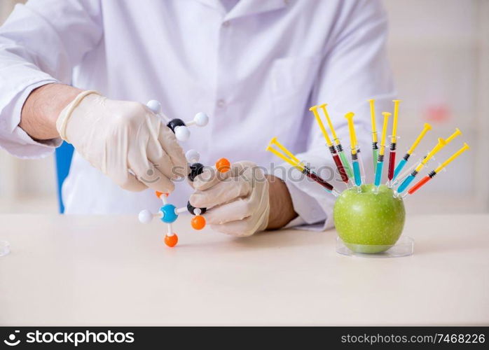 The male nutrition expert testing food products in lab. Male nutrition expert testing food products in lab