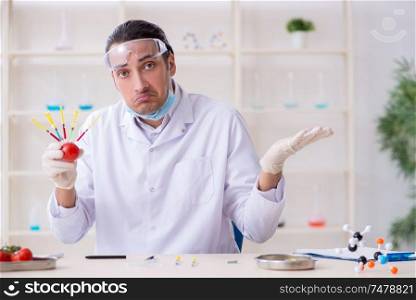 The male nutrition expert testing food products in lab. Male nutrition expert testing food products in lab