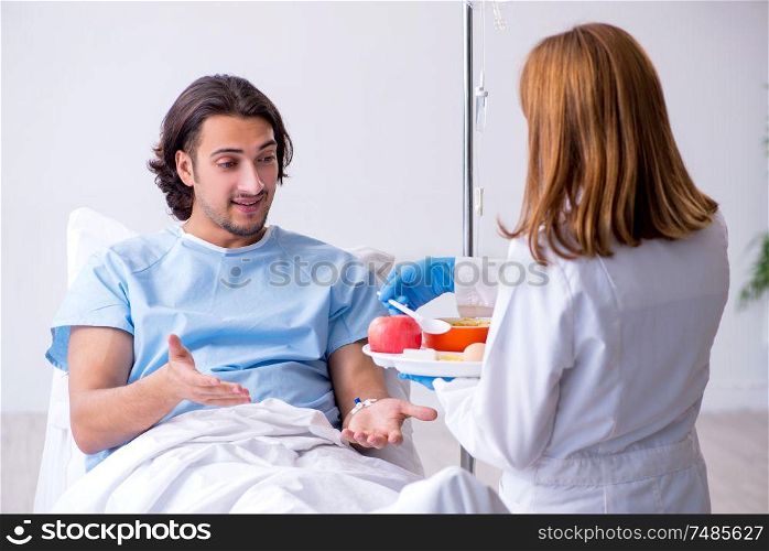 The male patient eating food in the hospital. Male patient eating food in the hospital