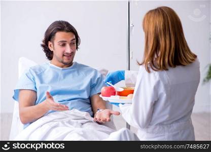 The male patient eating food in the hospital. Male patient eating food in the hospital