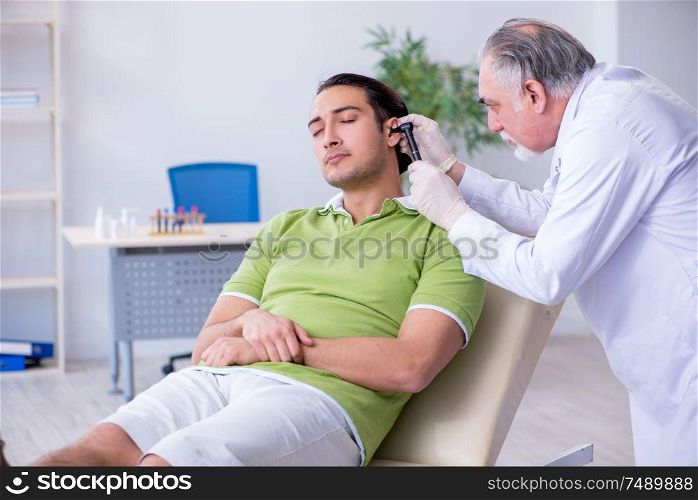 The male patient visiting doctor otolaryngologist. Male patient visiting doctor otolaryngologist