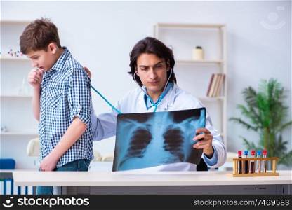 The male radiologist looking at boy&rsquo;s images . Male radiologist looking at boy&rsquo;s images 