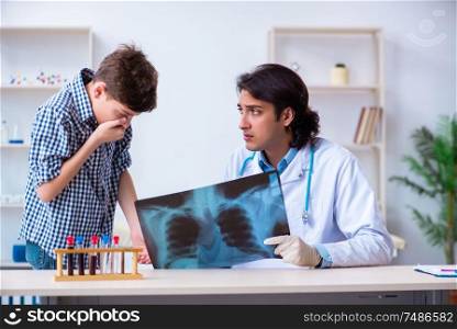The male radiologist looking at boy&rsquo;s images . Male radiologist looking at boy&rsquo;s images