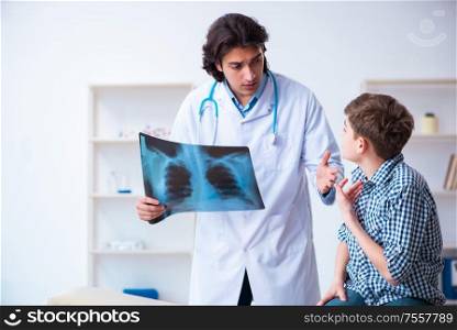 The male radiologist looking at boy&rsquo;s images. Male radiologist looking at boy&rsquo;s images