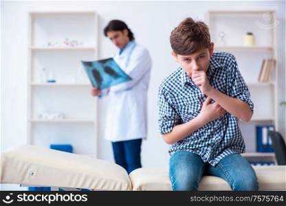 The male radiologist looking at boy&rsquo;s images. Male radiologist looking at boy&rsquo;s images