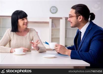 The male real estate agent and female client in the apartment . Male real estate agent and female client in the apartment 