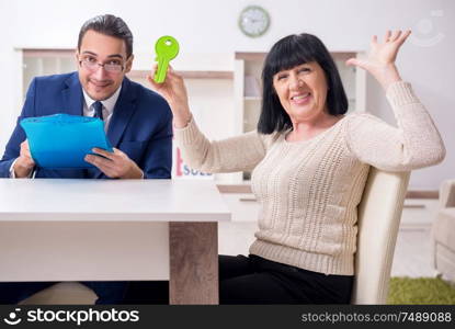 The male real estate agent and female client in the apartment. Male real estate agent and female client in the apartment